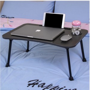 Folding table on computer bed