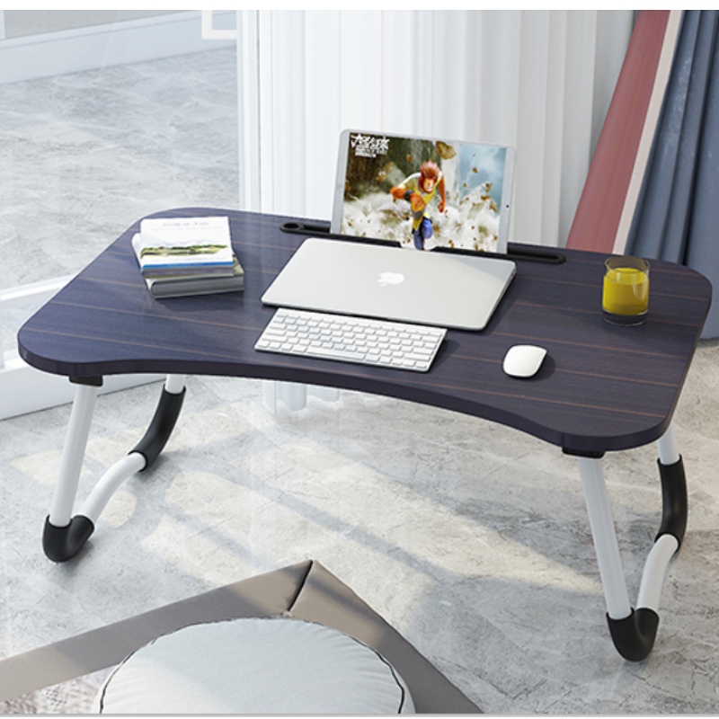 Folding table on portable bed
